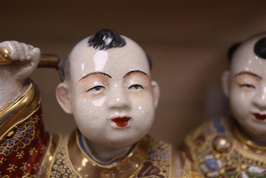 A Satsuma pottery group of two boys drumming, height 28cm